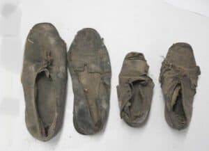 Four old shoes photo.